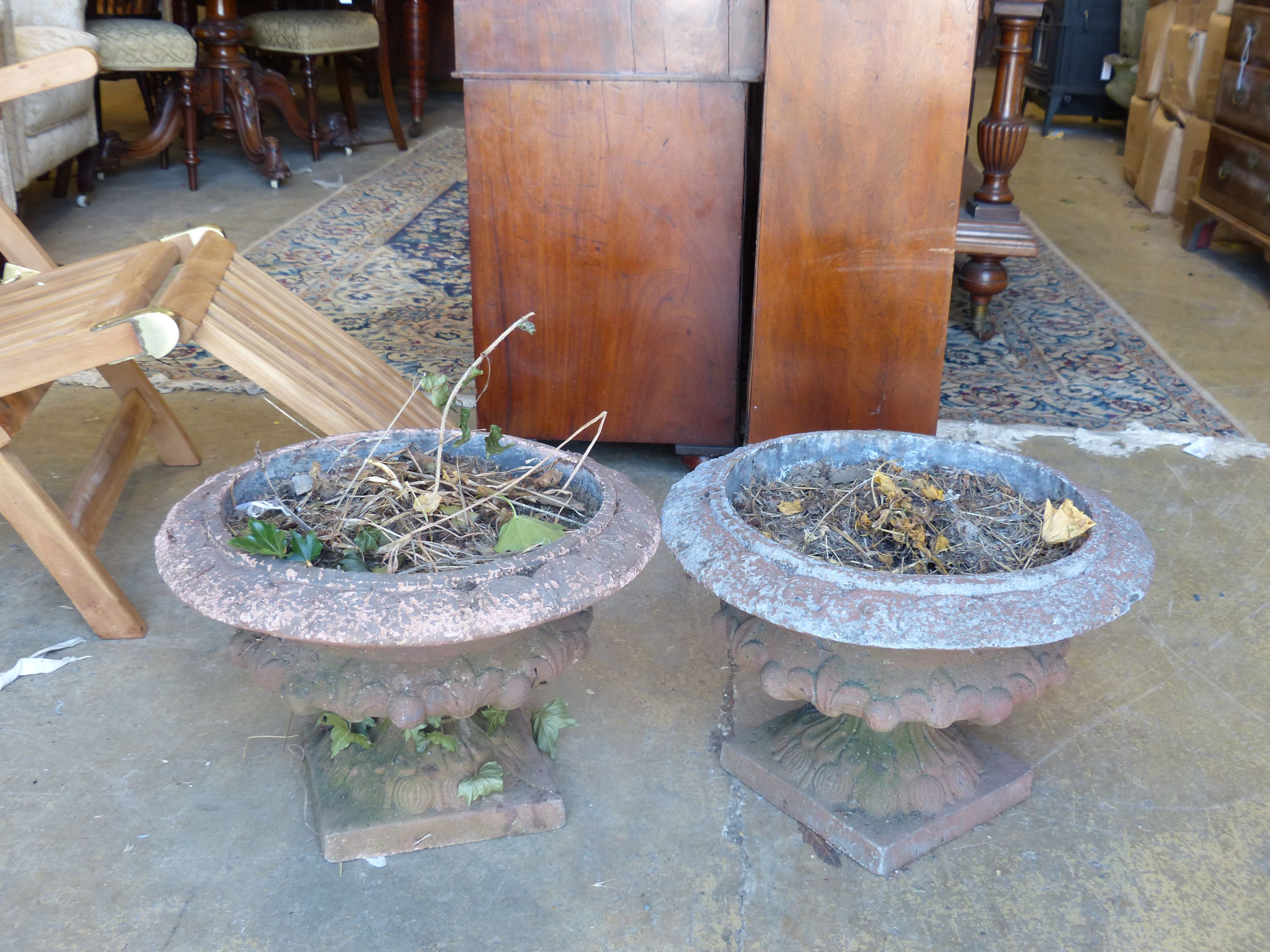 A pair of terracotta campana garden urns, diameter 44cm, height 30cm